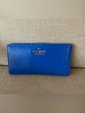 kate spade cobalt patent leather wallet with gold logo